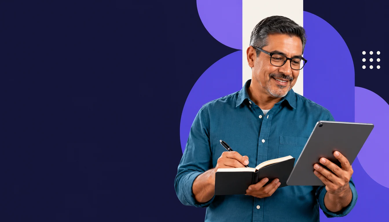 A Mexican entrepreneur consults a tablet while taking notes in an open notebook.