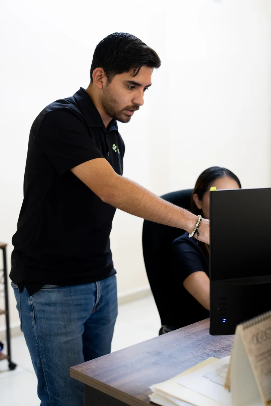 Fintax accountant helping a colleague in the office